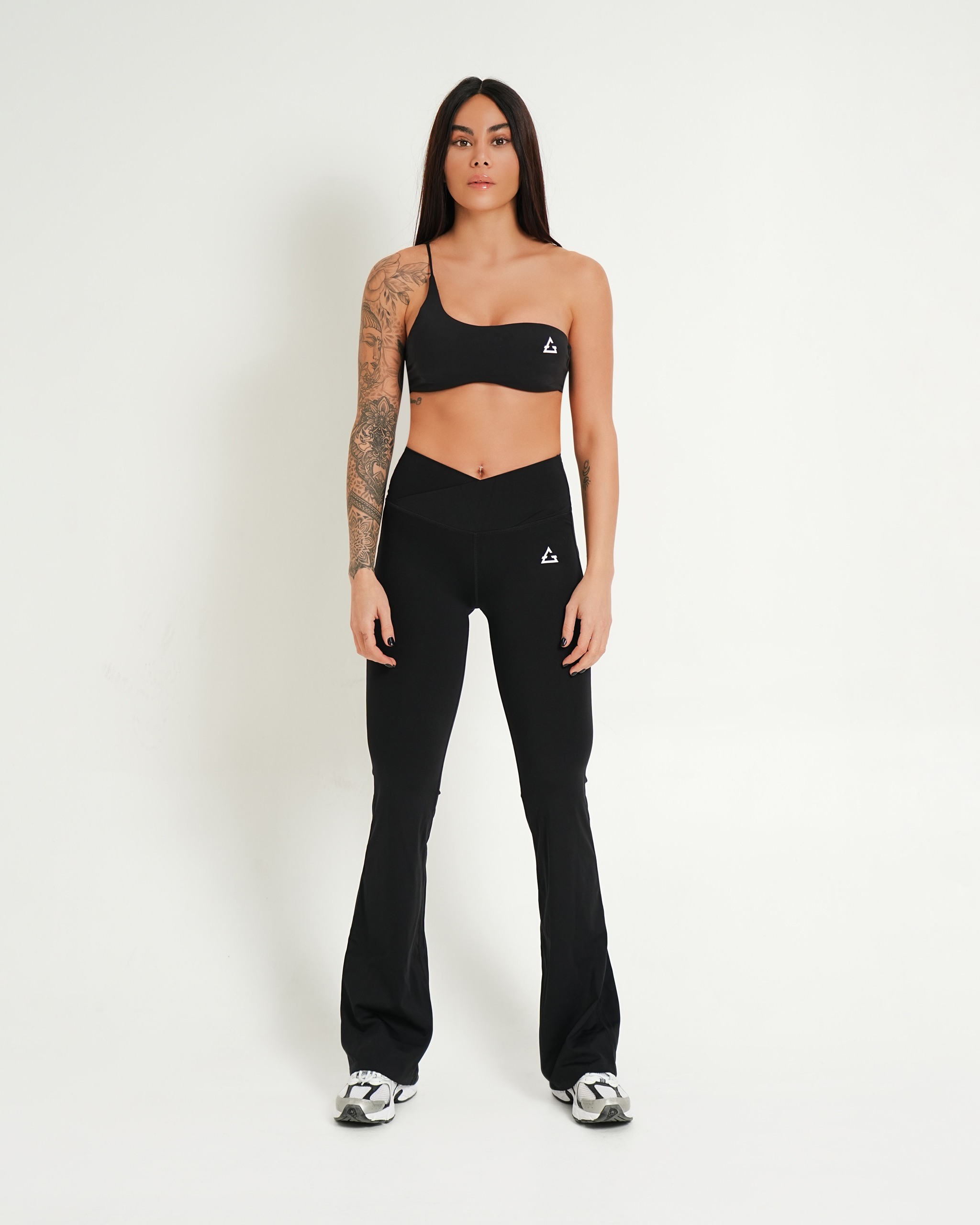 Gravity Luxe compression flare pants with crossover waistband in black